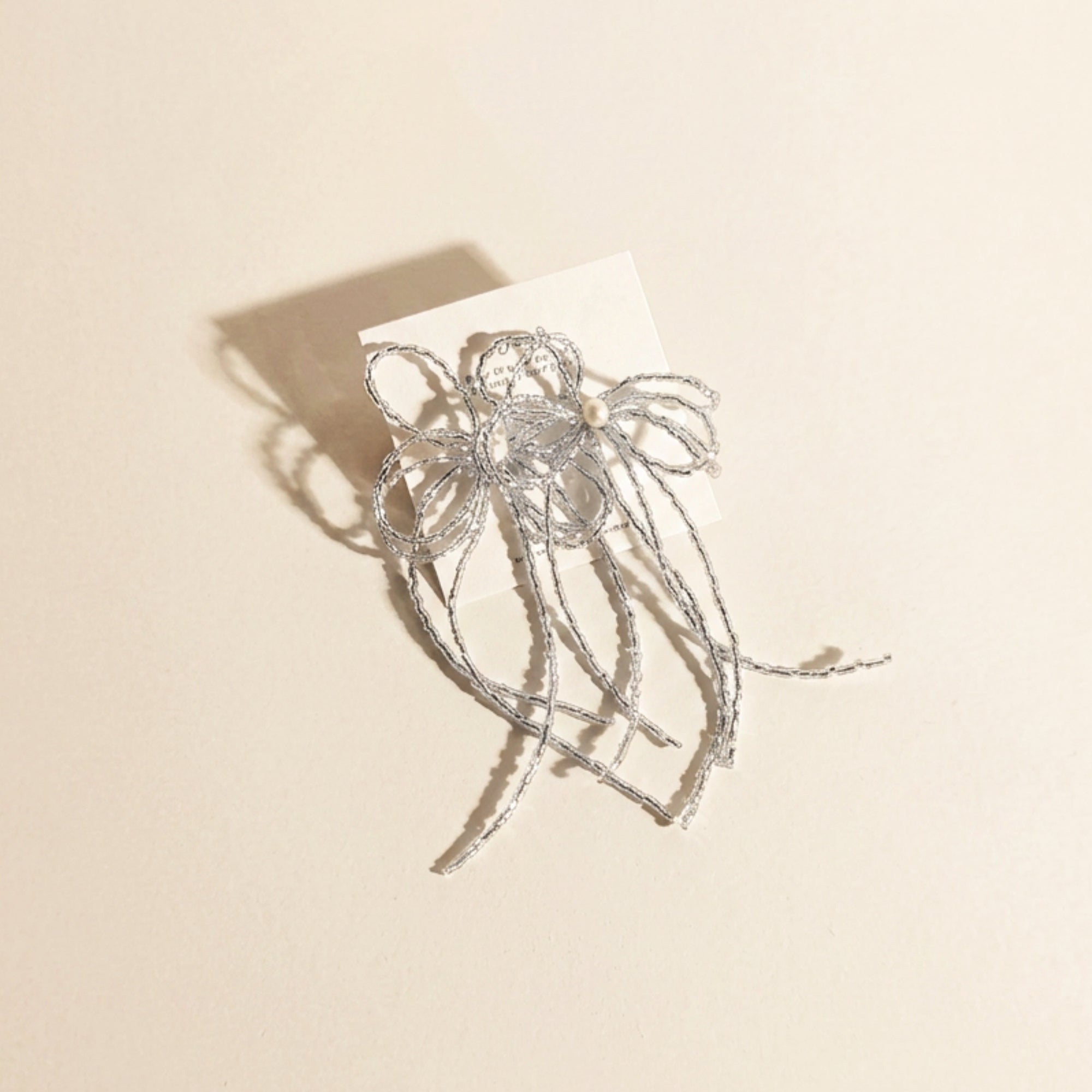 Boucles nœud avec perle